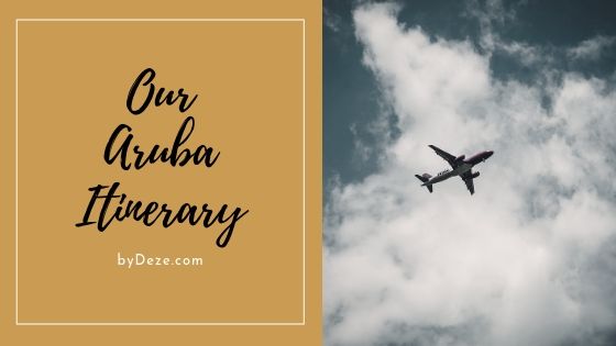 a plane in the sky our aruba itinerary