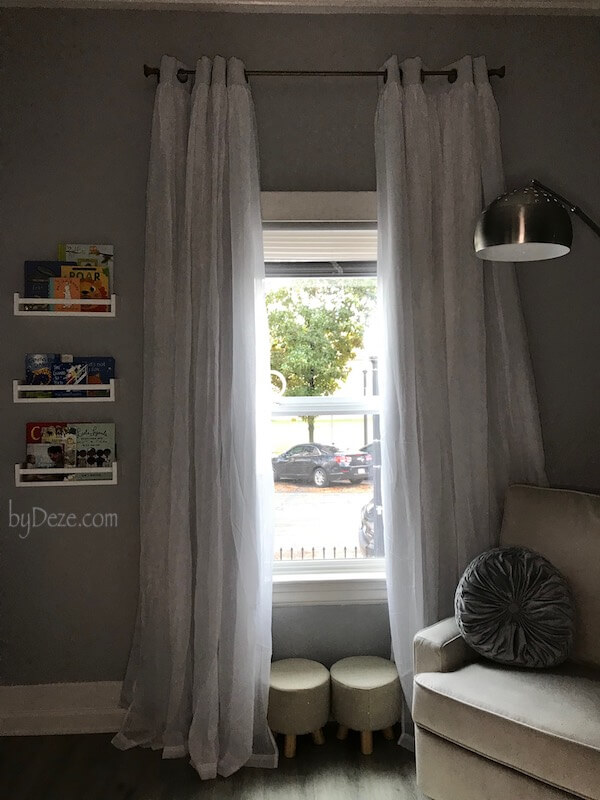 nursery window, curtains and books
