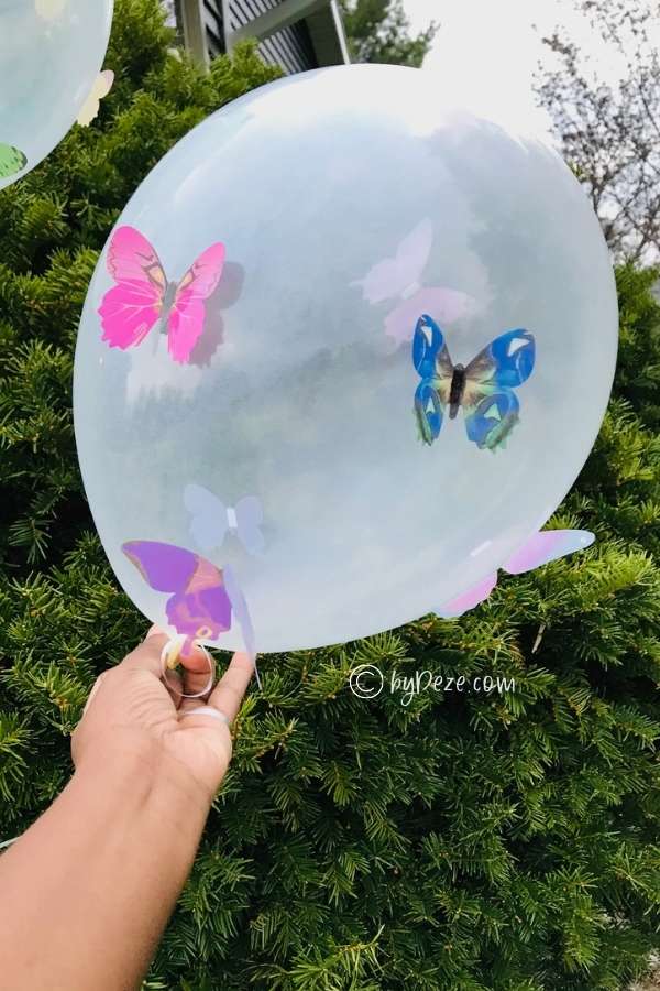 close up of clear balloon with butterflies