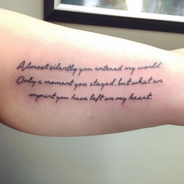 quote tattoo of the little footprints poem on an arm