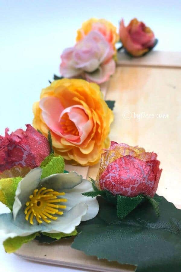 close up of faux flowers for diy flower picture frame