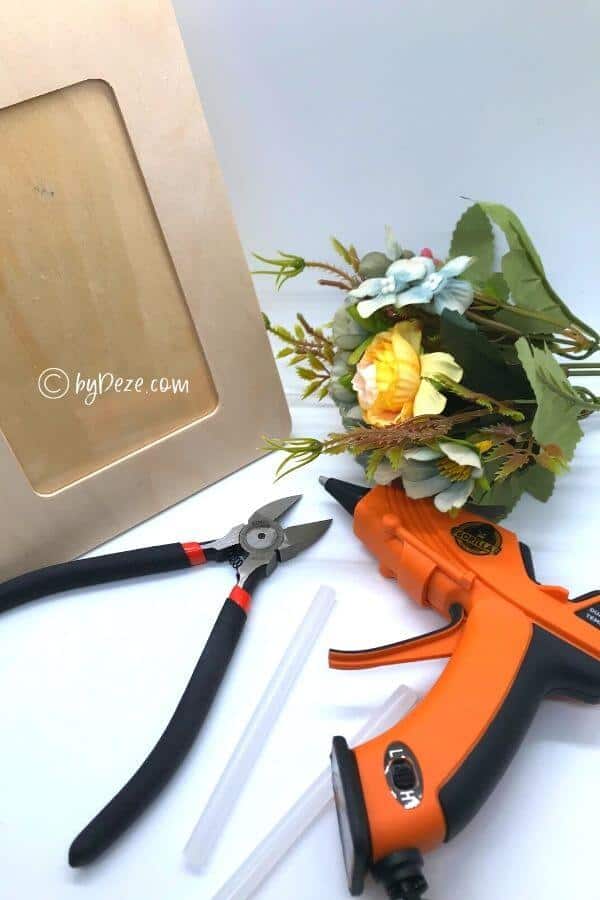 floral photo frame project flat lay