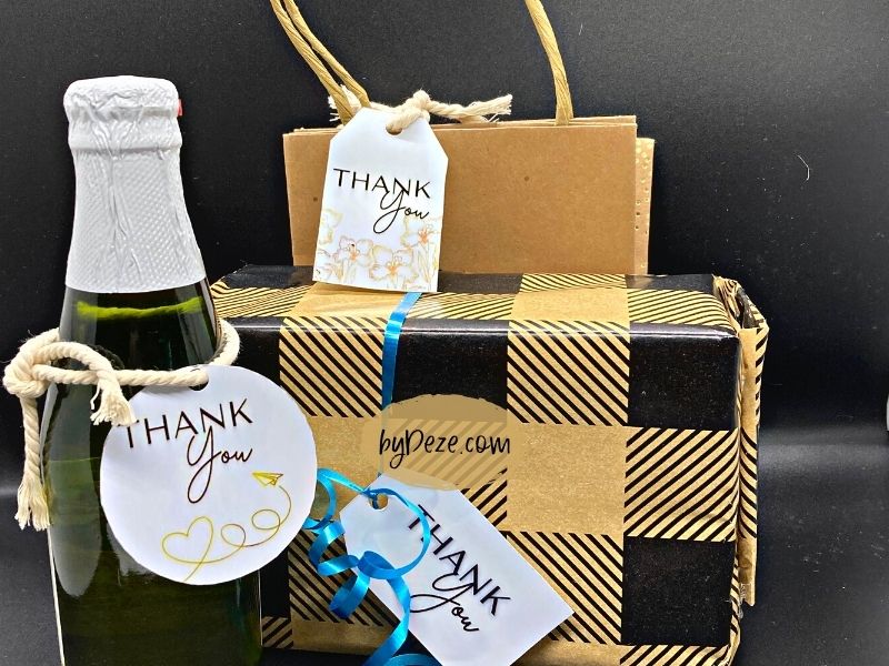 printed thank you gift tags displayed on bags and wine