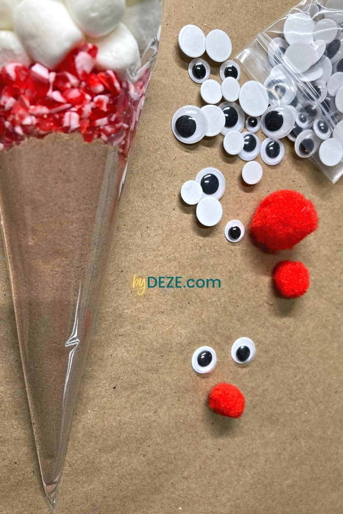 pom poms and googly eyes for hot cocoa reindeers