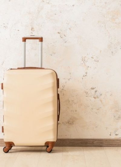 beige suitcase for must have travel items