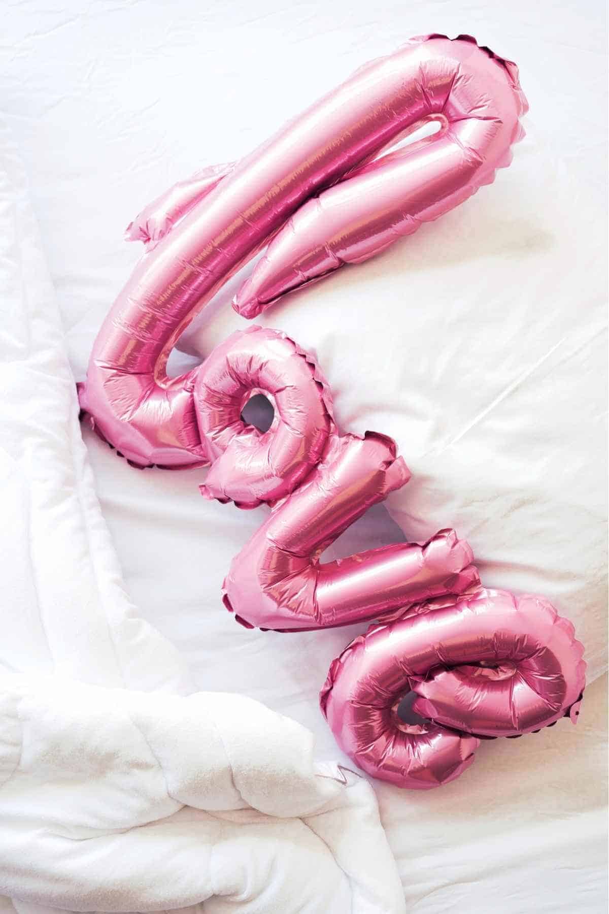 love balloons in bed sheets